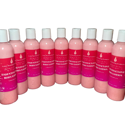 Row of pink bottles with white caps and red labels on a white background
