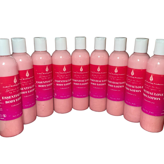 Row of pink bottles with white caps and red labels on a white background