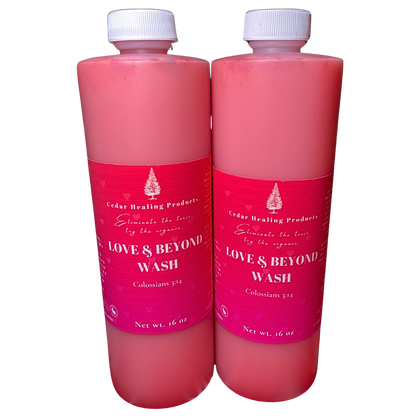 Two bottles of 'Love & Beyond Wash' with pink liquid and white caps on a white background.